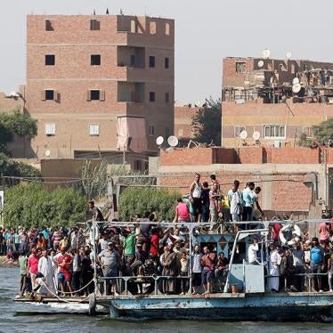 Egyptians shout slogans against the government while on a ferry during the funeral of Syed Tafshan, who died in clashes with residents of the Nile island of al-Warraq island, when security forces attempted to demolish illegal buildings, in the south of Ca