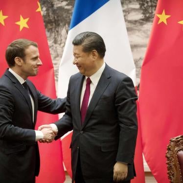 French President Emmanuel Macron and Chinese President Xi Jinping shaking hands after releasing joint press remarks at the Great Hall of the People in Beijing on January 9, 2018. © 2018 Kyodo via AP Images