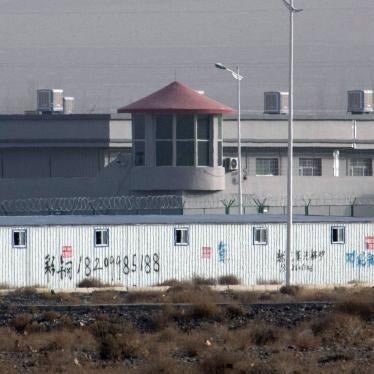 In this Monday, Dec. 3, 2018, file photo, a guard tower and barbed wire fences are seen around a facility in the Kunshan Industrial Park in Artux in western China's Xinjiang region. China has responded with swift condemnation on Wednesday, Dec. 4, 2019, a