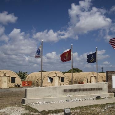 In this photo reviewed by US military officials, flags fly in front of the tents of Camp Justice, April 18, 2019, in Guantanamo Bay Naval Base, Cuba.