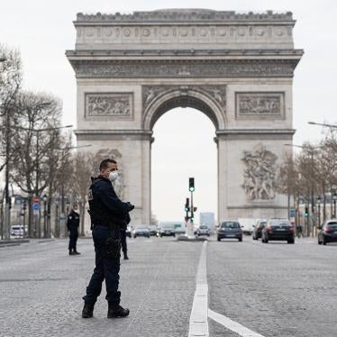 Police patrol near the Arc de Triomphe on the first day of confinement due to COVID-19, Paris, France, March 17, 2020.