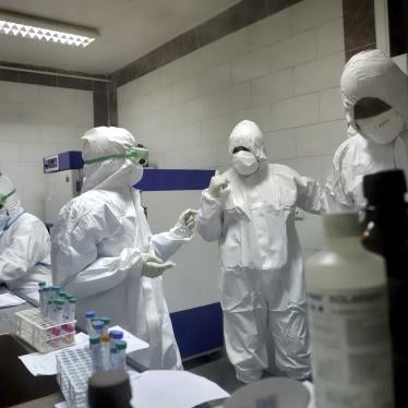 Paramedics work in a laboratory that tests samples taken from patients suspected of being infected with the new coronavirus, in the southwestern city of Ahvaz, Iran, March, 10, 2020.